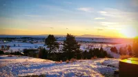 Cozy modern cabin with amazing views, hot tub, firepit, and more!  5 min to town