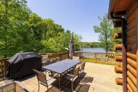 Enchanting 5-Bed/5-Bath Lakefront Log Cabin with Private Cove, Beach & Hot Tub.