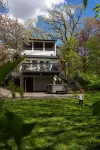 Charming Cottage with Hot Tub, Fire Pit, & Wooded Backyard