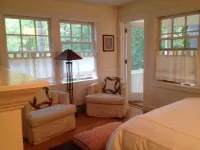 Short walk to village...with private wooded setting. EV Charger in parking area.