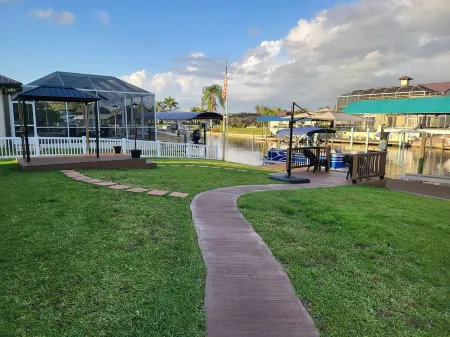 waterfront home, in a canal of the Caloosahatchee River with direct Gulf access.