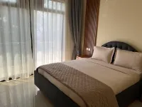 Q-Plus Apartments