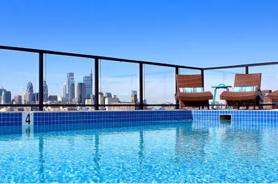 Stunning Rooftop Pool and Chic Amenities - Lavish Urban Escape