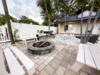 Shared Pool and Grilling Area with Fire Pit - Inviting Haven Hotels in Clearwater