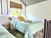 Charming 1-bedroom chalet in lush Poas with cascading pools & raw nature  WiFi Hotels in Poas