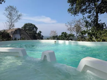 Cozy 2-bedroom cabin in Wayanad, built sustainably amidst lush greener