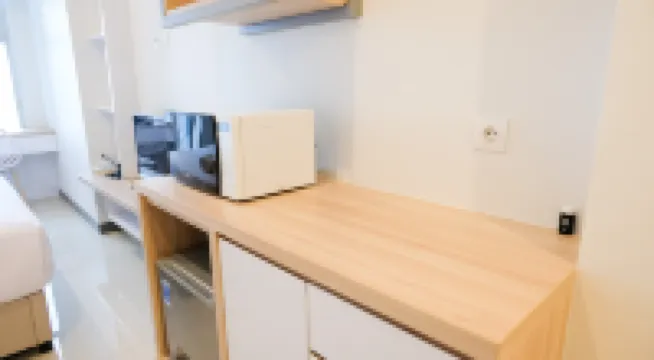 Cozy Stay Studio Connected with Mall at Supermall Mansion Apartment By Travelio