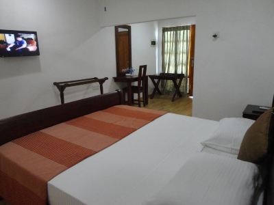 Standard room with various types of beds