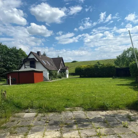 Kleine Ferienwohnung , Direkt am Deich und Hafen von Eckwarden mit Gartennutzung
