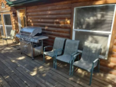 Location!  Nice log home in dark sky community next to several peaks