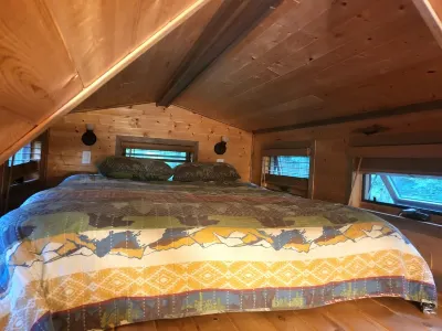 Tiny bungalow secluded in the woods with lake view.  Pets accepted!