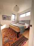 Sunlit loft with fireplace and king bed