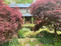 Charming Log Cabin Retreat with Flower Garden