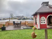 Chalet Gaby with Sauna, Private Dock, and Canoes at Lauwersmeer