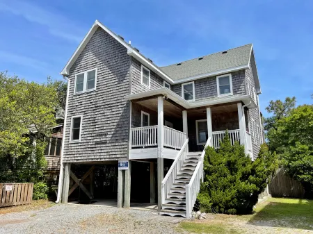 Charming Island Retreat with Spacious Yard and Screened Porches - Inviting Oasis