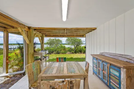 Sunset Sights Waterfront BBQ Fire Pit Dolphins