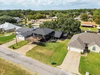 Rockstar waterfront lake house! Mid century modern with large 2 story party deck