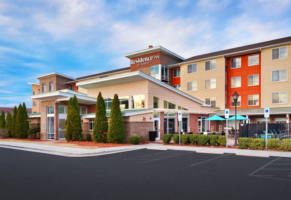 an exterior view of a hotel building , possibly a residence inn by marriott hotel , located in a residential area at Residence Inn Greenville