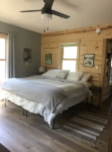 Cozy 2 bedroom cabin with fireplace steps to sand bottom swimming and lake views Hotels in Burnett County