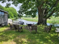 Cozy cottage that sits along canal of Sandy Pond.