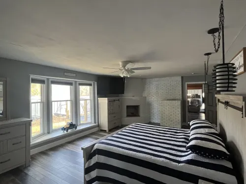 Lake Front Home with 3 steps to water, private dock, quiet cove & flat yard