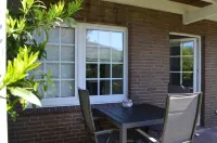 Bright, spacious comfort apartment with private garden and walk-in shower.