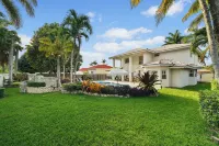 Poolside Paradise: Cozy Miami Getaway Hotels near Our Lady of Lourdes Catholic Church