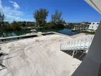 NEW RENTAL!!! Conch Heaven is a four bedroom house on a canal with a dock.