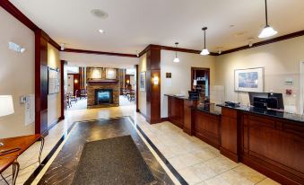 a large hotel lobby with multiple reception counters and a fireplace , creating a welcoming atmosphere at Staybridge Suites Philadelphia Valley Forge 422