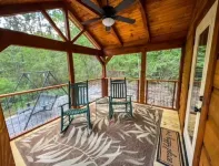 Secluded cozy tiny cabin on the water with fire pit and private dock