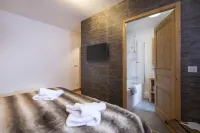 Appart 130m², full services  , 4 bedrooms, 4 bathrooms / d, south balcony and 2 parking spaces Hotels in Montvalezan