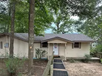 Peaceful lake front home with wrap around porch and relaxing views!