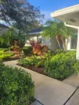Golf cart distance to WEF! Charming 3 bedroom waterfront home with heated pool.