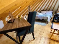 Elevated eclectic yurt with wrap-around porch, hot tub, and mountain view! Hotels in Piper Gap