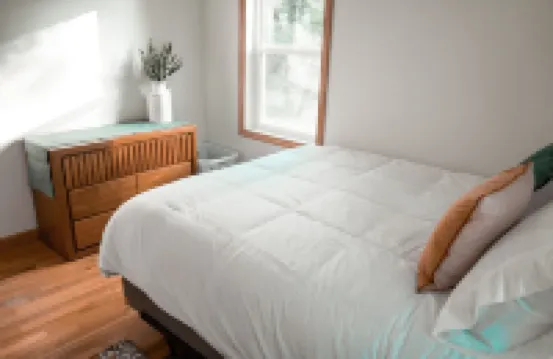 Remodeled home in the woods, just past city limits. With horse pasture nearby!