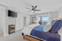 Charming Retreat with Fenced Yard and Partial Ocean Views - Cozy Escape Hotels in Lower Grand Lagoon