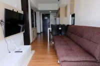 Homey and Cozy 2Br Apartment at Tamansari la Grande