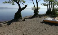 Independent villa with private beach on the lake