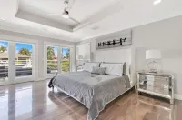 "Luxury waterfront mansion with large pool" Near clear water & sandy beaches !