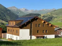 New vacation apartment in the middle of the SkiArena Andermatt Sedrun with indoor golf course