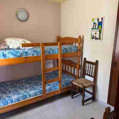 Beautiful house surrounded by an idyllic garden with salt water pool. Rooms