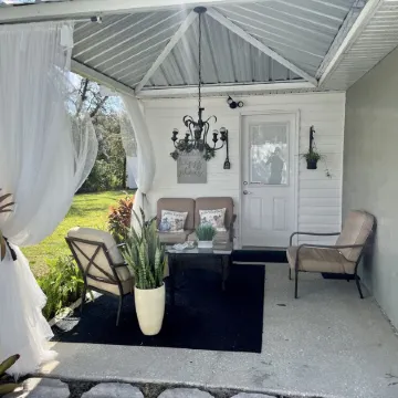 Modern studio apartment with covered outside seating area