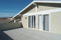 Charming 4-bedroom house with pool table and AC near Las Vegas strip! Hotels near The Arroyo Market Square