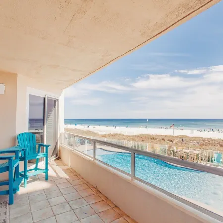 Luxurious 2nd floor beachfront condo w wrap-around balcony @ The Enclave