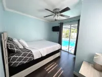 Quiet Pool Haven: 4BR - 9PPL, AC, WiFi, and Beaches Nearby