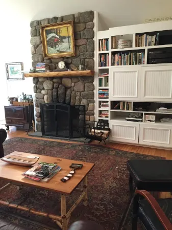 Short walk to village...with private wooded setting. EV Charger in parking area.