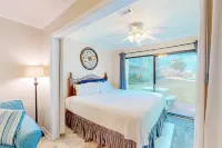 Water view studio with a patio, pool access, and central AC - snowbird friendly