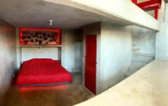 Eclectic Cliffside Den with Hanging Living Area