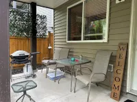 Lrg 1 bdrm ground level suite with a Private Entry in a forest setting.