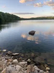 Cozy cabin with deck and fireplace steps from White Pond Lake. Dog friendly.